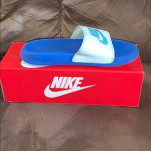 Blue Nike slides